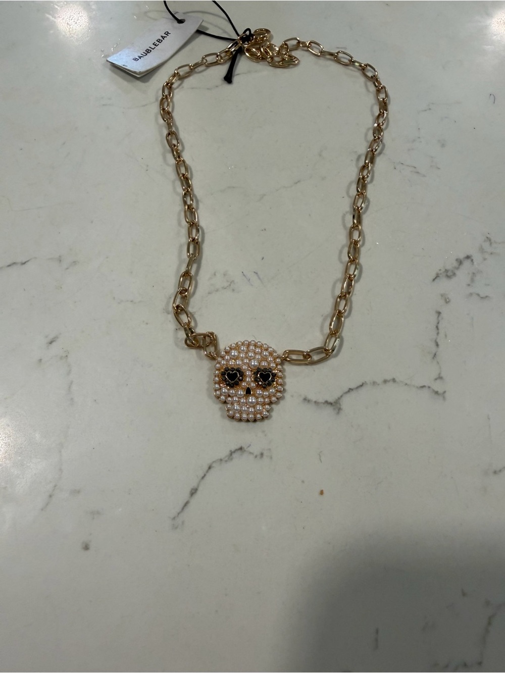BaubleBar Gold Pearl Skull Necklace with Black Eye Accents